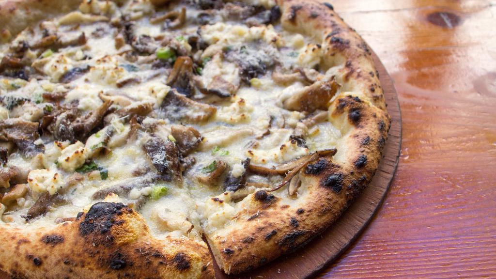 Mushroom Pizza · Garlic, fontina, scallion, ricotta, and parmigiano.