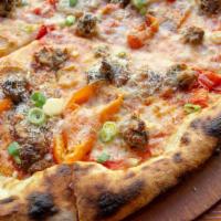 Italian Sausage Pizza · Tomato sauce, spicy sausage, smoked mozzarella, potato, mama Lil's peppers, parmigiano, and ...