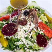 Greek Salad · Romaine lettuce topped with homemade vinaigrette and Feta cheese, kalamata olives, boiled eg...