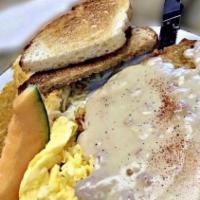 Country Fried Steak And Eggs · Gravy.