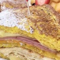 Monte Cristo · Triple Decker French toast stacked with ham, swiss, turkey and cheddar, sprinkled with powde...