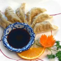 Pot Stickers, 6 Pieces · Homemade dumplings stuffed with vegetables and served with thai-style soy ginger sauce. Choo...