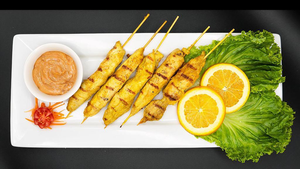 Chicken Satay (5) · Tender grilled chicken marinated in thai satay spice and coconut milk. Served with peanut sauce or cucumber sauce.