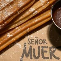 Churros In A Box · Enjoy fresh fried churros, cinnamon, and sugar with our Mexican chocolate sauce.