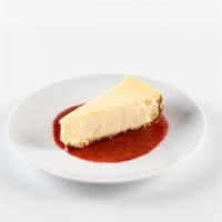 New York-Style Cheesecake · Topped with salted caramel and chocolate sauce