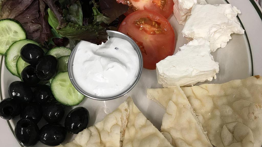 Mediterranean Plate · Sliced warm pita, tzatziki sauce, sliced tomatoes, feta cheese, kalamata olives, sliced onions and cucumbers