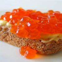 Caviar · Red caviar on a toasted bread with butter or cream cheese