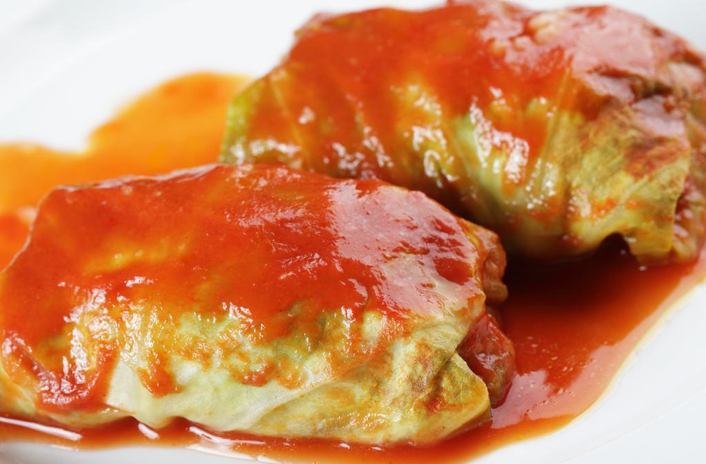 Stuffed Cabbage Rolls (2) · Homemade cabbage leaves stuffed with pork, beed, rice, carrots and spices, simmered to perfection in tomato sauce, 2 per serving