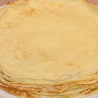 Blintzes (Russian Style Pancakes) · blintzes with served with a side of European style jam and sour cream