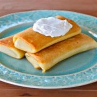 Blintzes With Farmer Cheese  · Russian style pancakes filled with farmer cheese