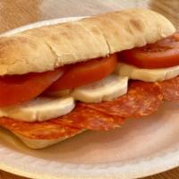 Corleone Sandwich · Salami, mozzarella, tomatoes, pink sauce.