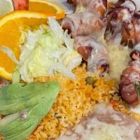 Stuffed Shrimp · 7 stuffed shrimp with bacon, topped with cheese. Served with beans, rice, lettuce, tomatoes,...