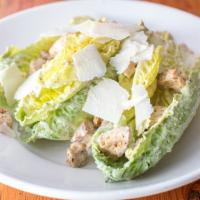 Caesar Salad · Whole romaine heart leaves, parmigiano reggiano and house-made croutons with our house Caesa...