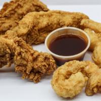Chicken & Shrimp · 3 chicken tenders and 6 shrimp served with 2 sauces. Served with your choice of side.