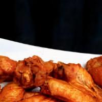 Wings (8 Pcs) · Comes with 4 homemade battered chicken tenders, carrots, celery, and a choice of blue cheese...