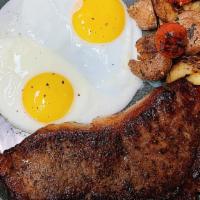 Steak & Eggs · Eight ounce New York steak with herb roasted potatoes, tomatoes and eggs.