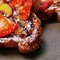 Ultimate Banana Strawberry Toast · 2 large pieces of butter croissant toast with banana, strawberries  nutella, peanut butter a...