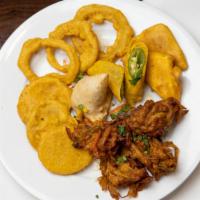 Pakora Delight · Sliced onions and bell peppers dusted in gram flour and deep-fried to crisp.