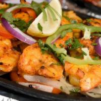 Shrimply Irresistible Tandoori · Shrimp marinated in creamy yogurt sauce and cooked in a clay oven for a smoky flavor.