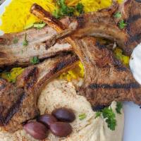 Rack Of Lamb · Four pieces of marinated rack of lamb, charbroiled and tzatziki sauce. Served with one pita ...