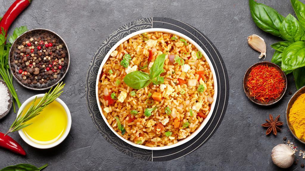 Fried Rice · Onions, tomatoes, carrots, green onions, bok choy, eggs and your choice of meat.