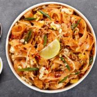 Pad Thai · Rice noodle in House Pad Thai sauce with bean sprouts and green onions topped with crushed p...