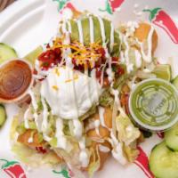 Flautas · 2 deep fried corn tortillas with your choice of meat, lettuce, tomatoes, guacamole, sour cre...