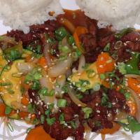 Mongolian Beef · Beef, green onions, sliced yellow onions, matchstick carrots.