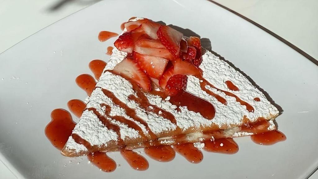 Strawberry Cheese Crepe · Crepe filled with cream cheese and topped with powdered sugar, fresh strawberries and strawberry syrup.