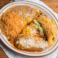 Chiles Rellenos (2) · Two stuffed peppers with Monterey cheese, battered with eggs.