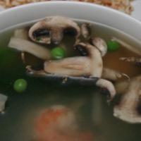 Sizzling Rice Soup · Chicken, shrimp, water chestnuts, mushrooms, peas, spinach, light house broth, topped with a...