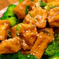 Sesame Tofu · Spicy. Fried tofu, broccoli, sesame seeds, garlic, ginger, chili house sauce.