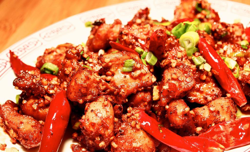 Zhen Bang Chicken · Spicy. Diced chicken, sichuan mah la berry, mandarin orange zest, chili pods, garlic, ginger tossed dry rub style.