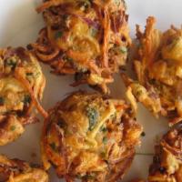 Vegetable Pakora · Vegetarian. Mixed fresh vegetables with delicious potatoes, chickpea flour, red and green pe...