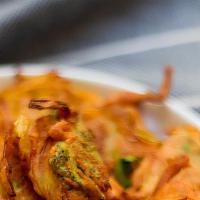Onion Pakora · Vegetarian. Sliced onion with homemade chickpea flour, batter pest, and house spices deep fr...