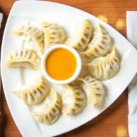 Vegetable Momo · Ginger, onion, salt, turmeric powder, olive oil, cumin powder, cabbage, carrot, red and gree...