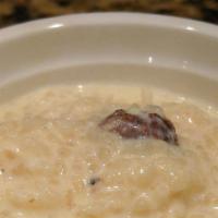 Kheer (Rice Pudding) · Jasmine scented rice boiled with milk coconut, cashew nuts, golden raisin sugar and house sp...