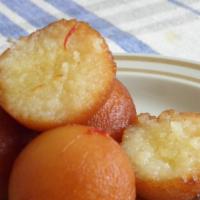 Gulab Jamun · A light pastry made from dry milk and flour and soaked in thick sugary syrup garnished with ...