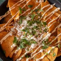 Chilaquiles Rojos O Verdes / Red Or Green Chilaquiles · Add con huevo, con carne asada o pollo for an additional charge.