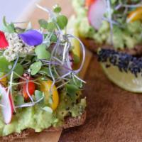 Avocado Toast · two slices of organic, vegan and gluten free toast topped with one whole large smashed avoca...