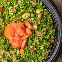 Tabbouleh Salad · Finely chopped parsley, tomatoes, mint, green onion, and cracked wheat seasoned with olive o...