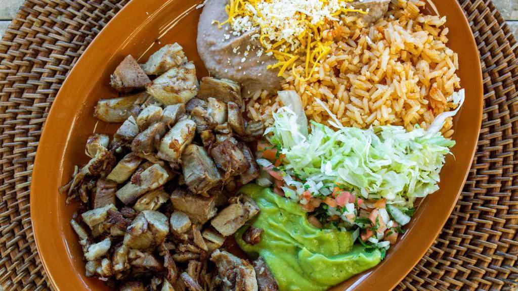 Carnitas · Pork, with Lettuce, guacamole and salsa mexicana. Served with Rice and Refried Beans. 3 Corn or 2 Flour Tortillas. (No substitutions.)