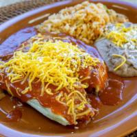 Two Tamales · Beef or chicken, topped with enchilada sauce, cheddar cheese, enchilada cheese. Served with ...