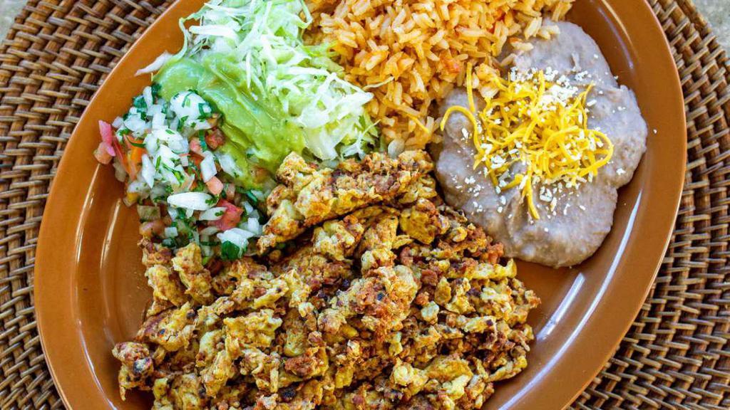 Chorizo Plate · Pork sausage with eggs, lettuce, guacamole and salsa Mexicana. Served with rice and refried beans. Three corn or one flour tortilla. No substitutions.