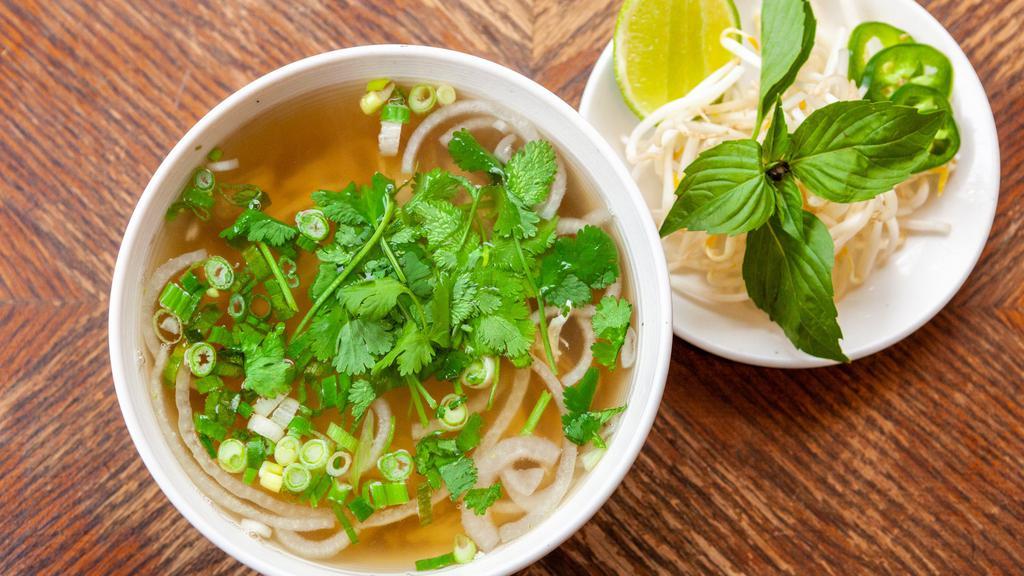Pho - Chicken (Gf) · Shredded chicken breast in Grandma's chicken pho broth, with rice noodles, onions, and cilantro. Served with a side of lime, jalapeños, bean sprouts, Thai basil.
