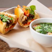 Banh Mi Combo - Pork Belly · Grandma's crisp and tender marinated pork belly in crisp airy French baguette. Stuffed with ...