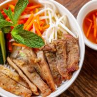 Rice Bowl W/Eggrolls · Grandma's pork w/vegetable eggrolls served with jasmine rice. Topped with cucumbers, pickled...