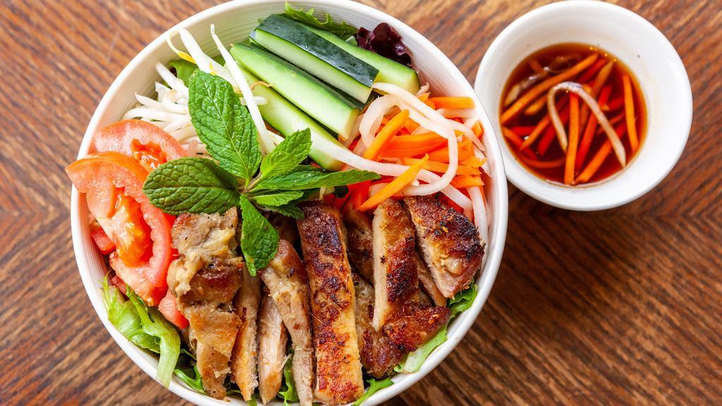 Salad Bowl W/Pork Belly (Gf) · Grandma's crispy and tender pork belly served with spring mix. Topped with tomatoes, cucumbers, pickled carrots, bean sprouts, and mint. Served with a side of housemade sesame soy vinaigrette and crushed peanuts.