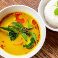 Vegetarian Curry (Gf,V) · Fried tofu, broccoli, cauliflower, and carrots in a light yellow coconut vegetarian curry br...