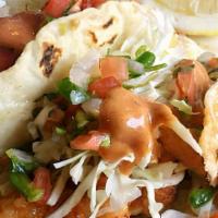 Tacos De Camaron · Three shrimp tacos. Pan fried topped with fresh cabbage, pico de gallo, and house dressing.
